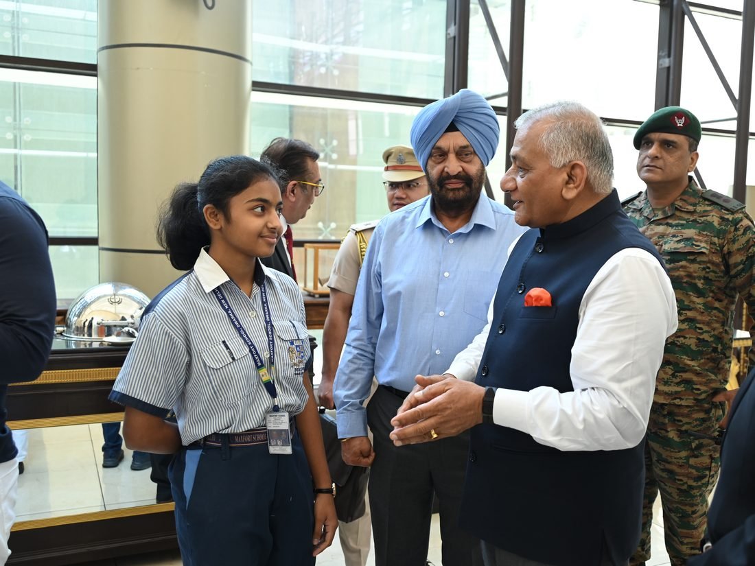 Gen V.K. Singh speaking with a student
